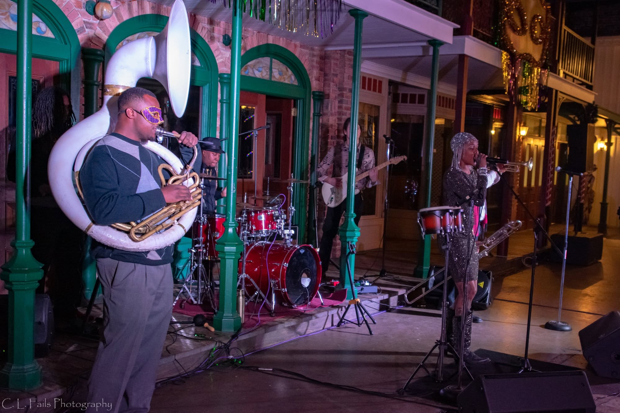 Live band and DJ entertainment performing at a Mardi Gras ball